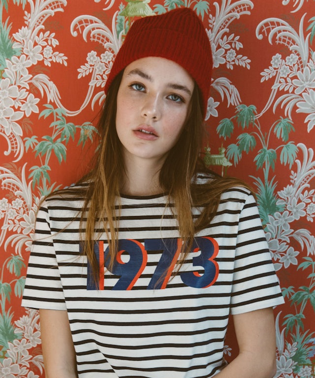 Model wearing The Modern 1973 Tee in cream/navy stripe