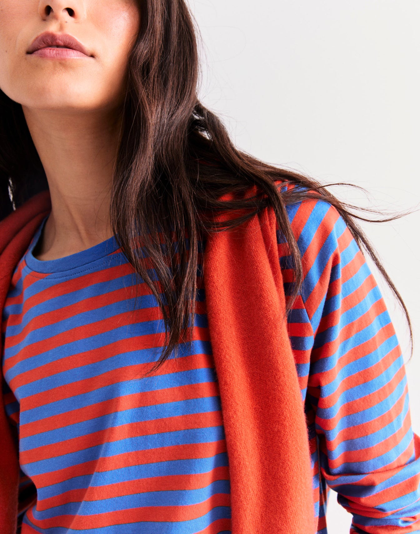 Close up image of model wearing The Modern Long - Royal/Poppy and The Sydney - Poppy