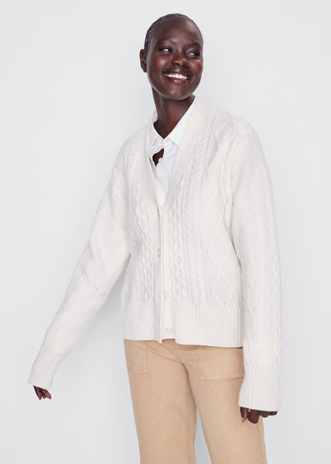 Model is wearing the cable Raffa cardigan in cream with the Hutton in white and the City pant in khaki